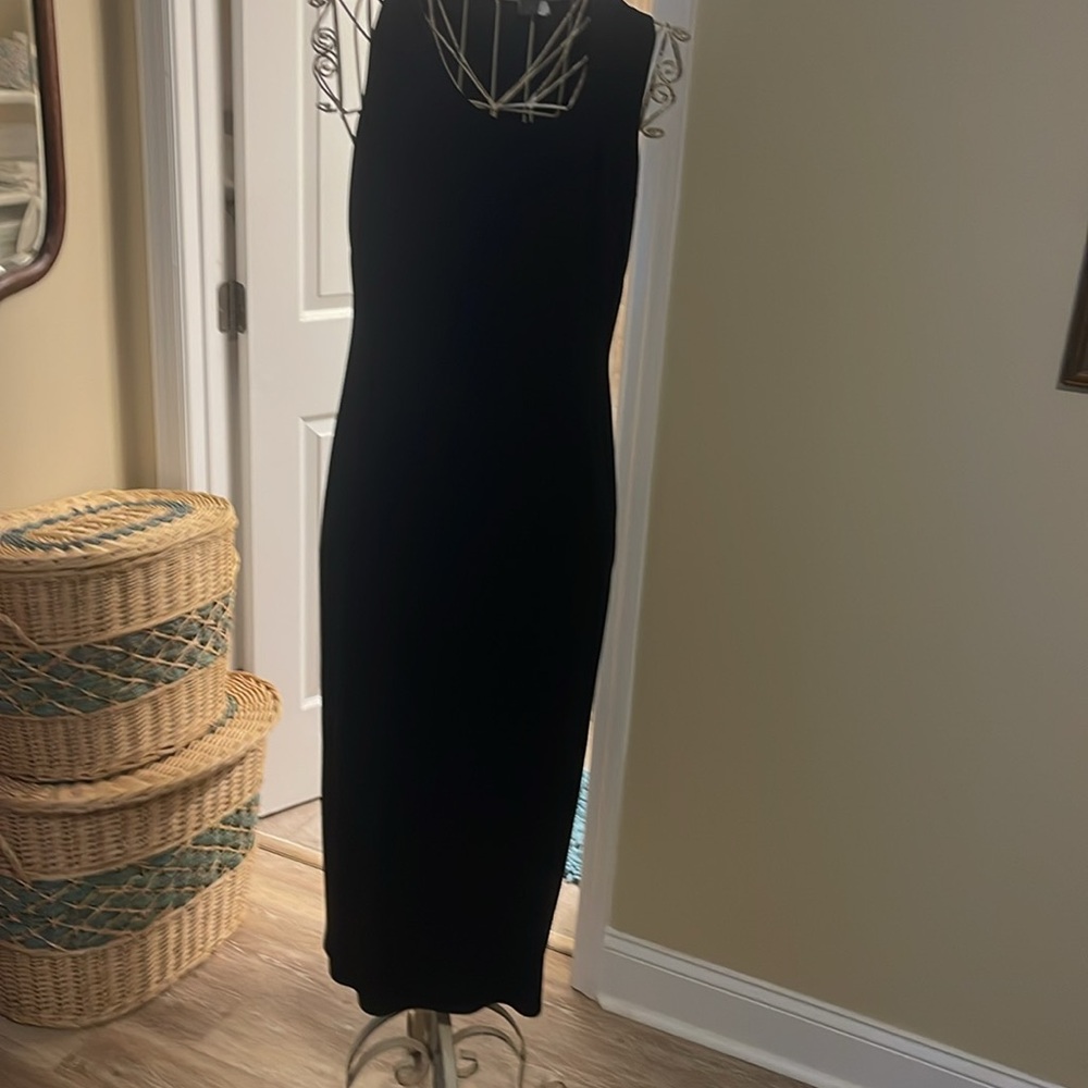 Woman’s sleeveless black dress size 14